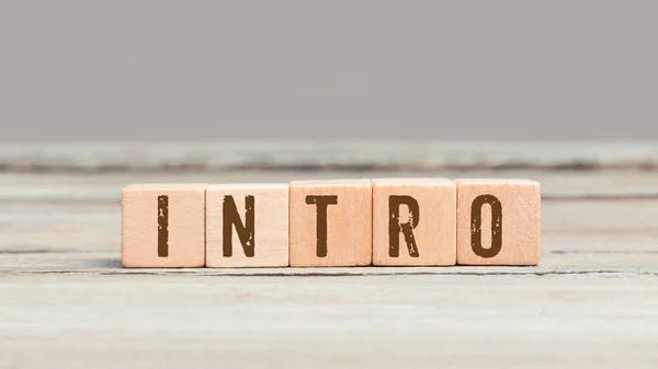 Word Intro Wood Cube Dices Aged Table — Stock Photo, Image