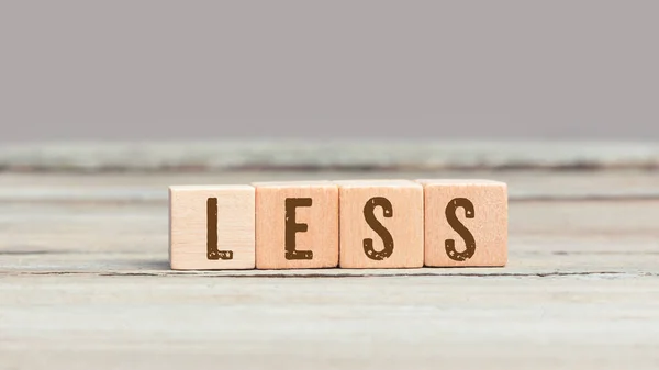 Word Less Wood Cube Dices Aged Table — Stock Photo, Image