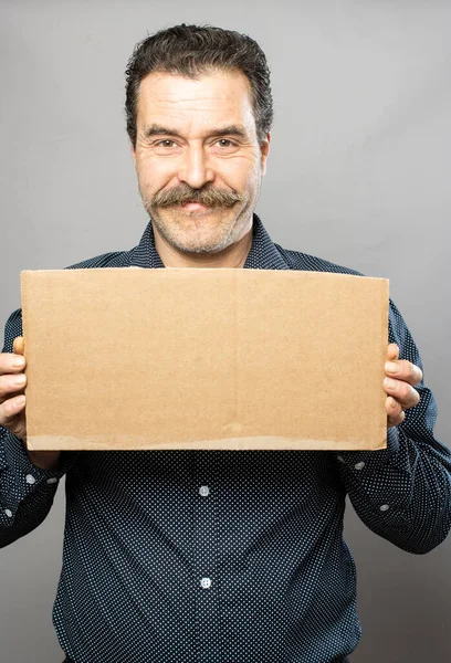 Man Holding Card Board Sign Studio Portrait Series Year Old — Zdjęcie stockowe