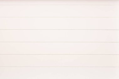 Close up to white boards of wood serving tablet with lines as background texture