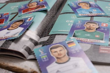 BERLIN, GERMANY - AUGUST 27, 2022: Panini collector stickers and album for the football world championship 2022 in Qatar.