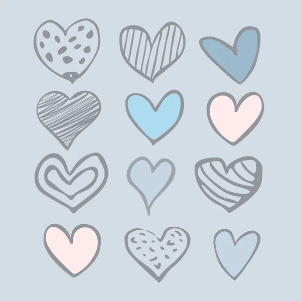 Set of twelve hand-drawn hearts isolated on a white background — Stock Vector