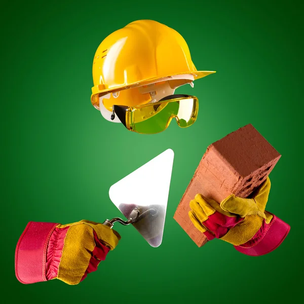 Invisible builder and trowel and brick — Stock Photo, Image