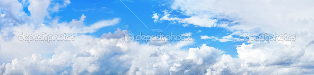 Panorama of beautiful blue sky with fluffy white clouds in sunny day
