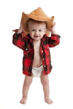 Portrait of toddler boy in a diaper, flannel shirt and a cowboy hat clipart
