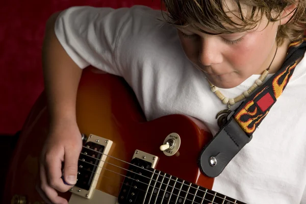 Child rock star plays electric guitar — Stock Photo, Image