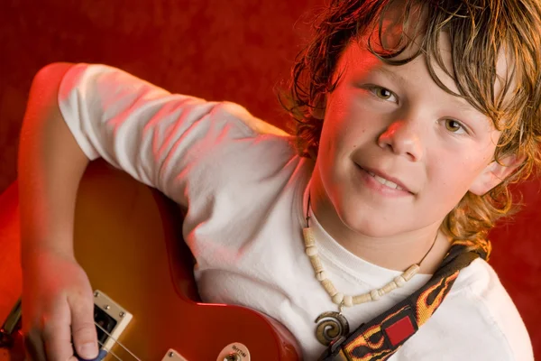 Child rock star plays electric guitar — Stock Photo, Image