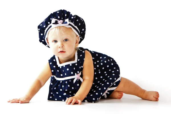 Caucasian toddler girl sitting on floor in dress — Stock Photo, Image