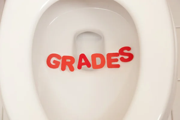 Bathroom toilet with the inscription grades — Stock Photo, Image
