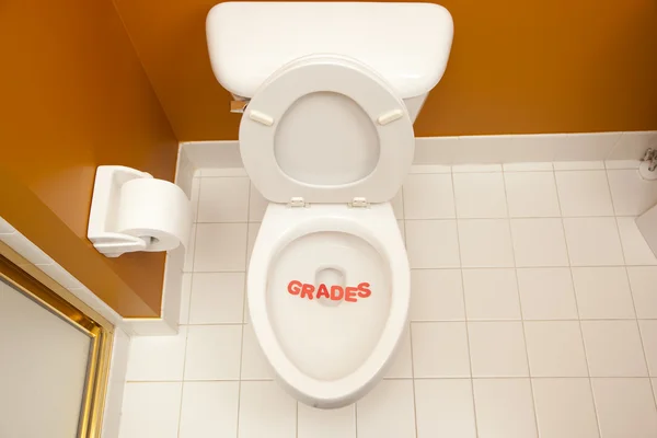 Bathroom toilet with the inscription grades — Stock Photo, Image