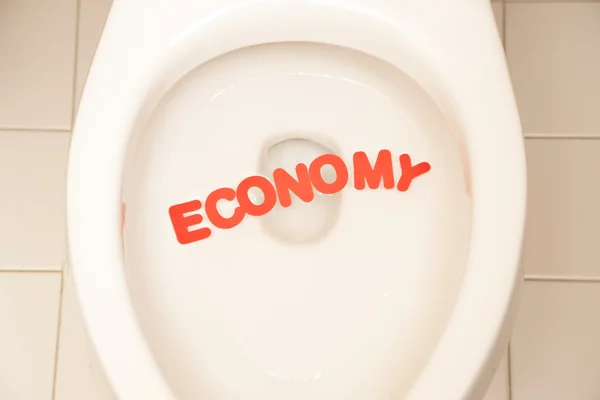 Bad-Toilette mit der Aufschrift Wirtschaft — Stockfoto