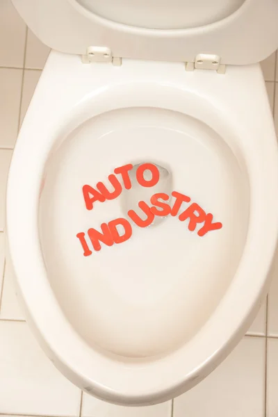 Bathroom toilet with the inscription automobile industry — Stock Photo, Image