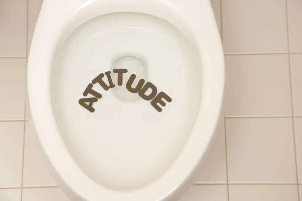 Bathroom toilet with the inscription attitude — Stock Photo, Image