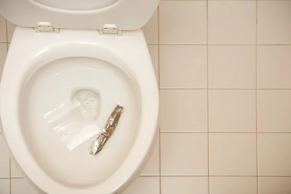 Overcoming addiction drugs in toilet — Stock Photo, Image