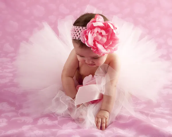 Cute baby girl wearing frilly tutu and headband — Stock Photo, Image