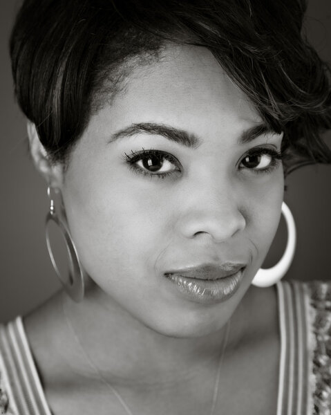 Black and white head shot of a pretty lady