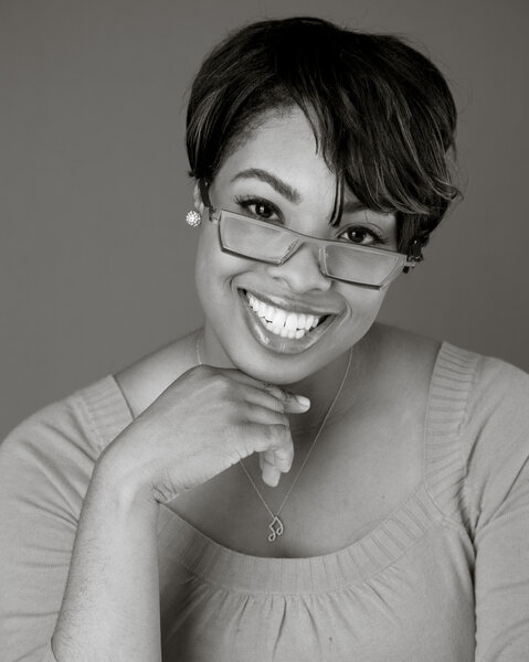 Black and white head shot of a beautiful black teacher or professor
