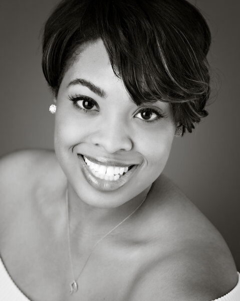 Black and white portrait of smiling black woman