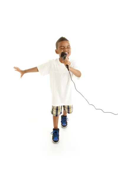 Cute boy performs a song — Stock Photo, Image