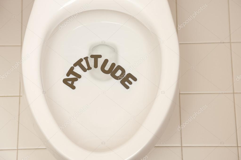 Bathroom toilet with the inscription attitude