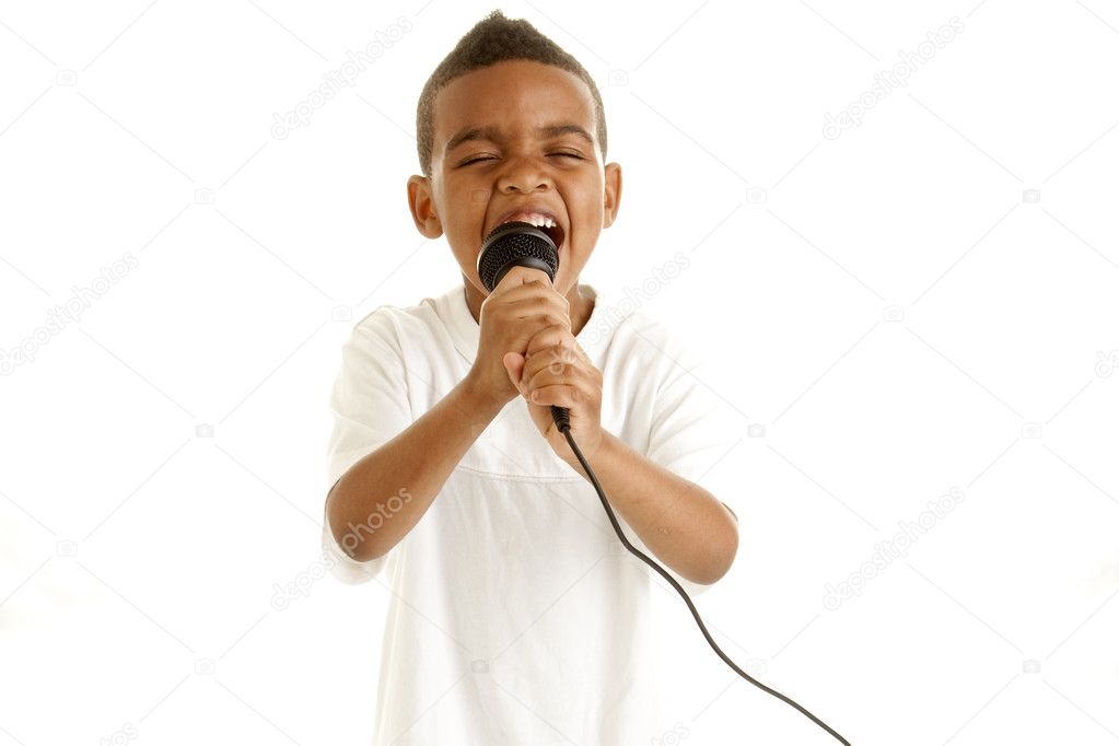 Little boy sings with microphone