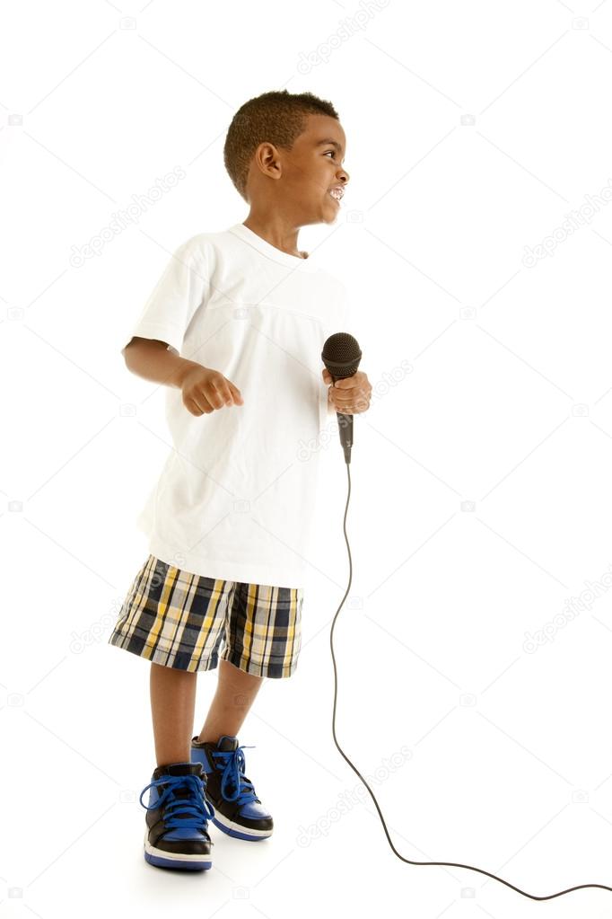 Little boy singing with a microphone Stock Photo by ©jbryson 21359965