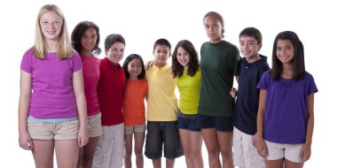 Smiling children of different ethnicities posing in colorful shirts