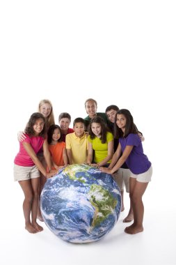 Сhildren of different ethnicities together around globe clipart