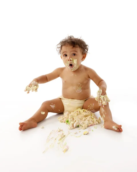 Toddler girl eating her first birthday cake — Stock Photo, Image