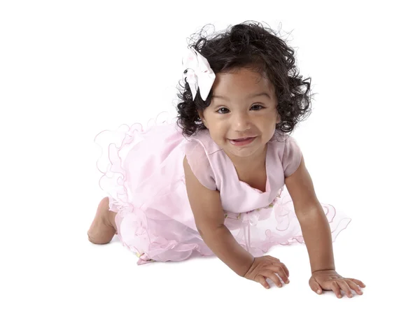 Toddler girl crawling in pink dress — Stock Photo, Image