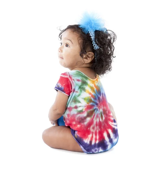 Mixed race toddler girl wearing tie dye and big bow — Stock Photo, Image