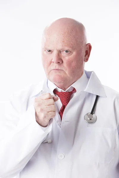 Retrato del médico haciendo un puño con una expresión severa —  Fotos de Stock