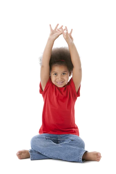 Happy african american little girl with her arms over head — Stock Photo, Image