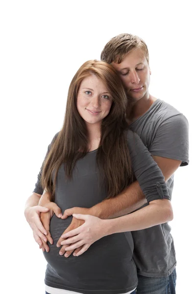 Padre in attesa sta con le braccia intorno donna pegnante — Foto Stock