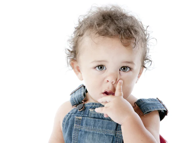 Toddler boy puts finger by his nose — Stock Photo, Image