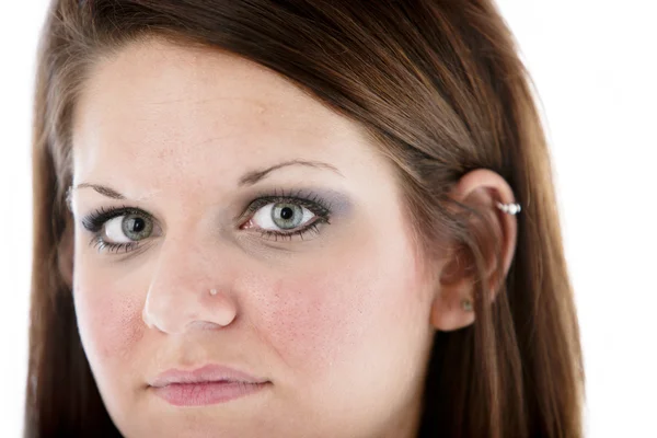 Closeup headshot of serious caucasian young woman — Stock Photo, Image