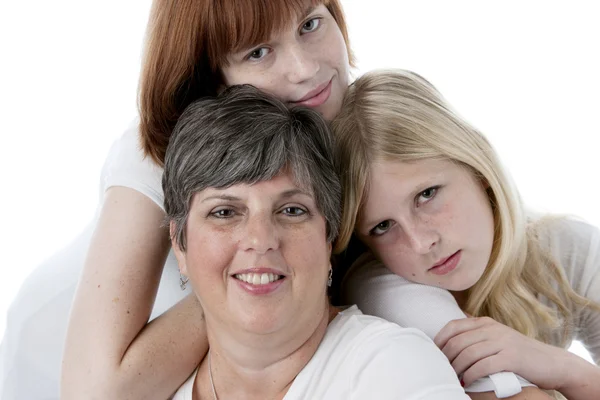 Headshot of smiling mother and her two daughters — Stock Photo, Image