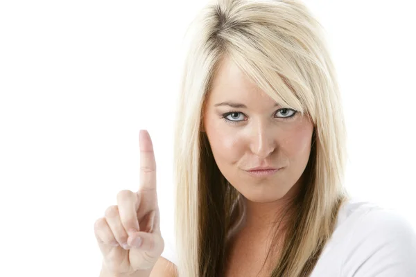 Молода жінка вказує пальцем, ніби вона каже "ні" або дає попередження — стокове фото