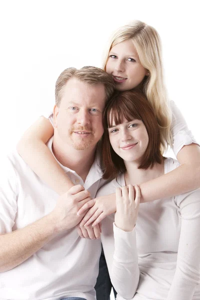Waist up image of father and two teenage daughters — Stock Photo, Image