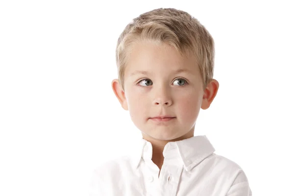 Imagen de niño caucásico con una expresión pensativa o curiosa en su cara —  Fotos de Stock