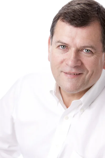 Headshot of a smiling caucasian mid adult man — Stock Photo, Image