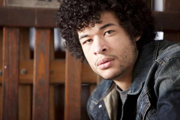 Young mixed race man with a serious expression on his face — Stock Photo, Image