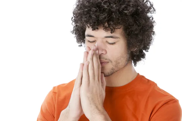 Praying or meditating mixed race young man — Stock Photo, Image