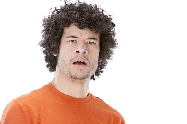 Mixed race young man with a look of disgust or disbelief on his face — Stock Photo, Image