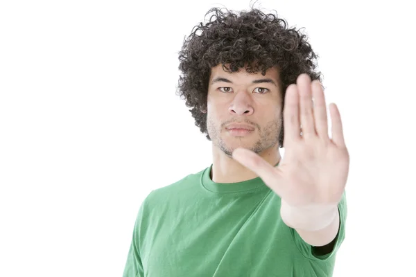 Joven de raza mixta levantando la mano como advertencia para decir alto — Foto de Stock