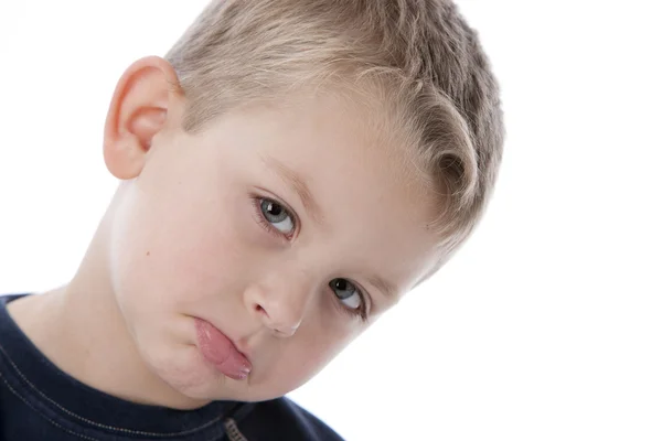 Little boy with sad expression on his face — Stock Photo, Image