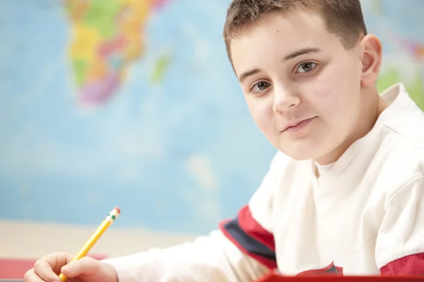 Headshot of caucasian boy studying or doing his homework — Stock Photo, Image