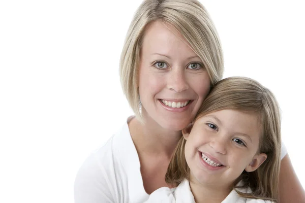 Headshot of smiling caucasian mother and daughter Royalty Free Stock Photos