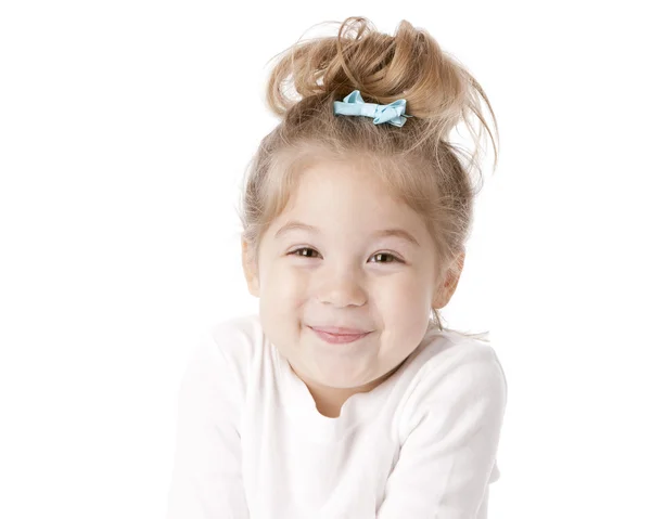 Smiling cute little girl with a bow in her hair Stock Photo
