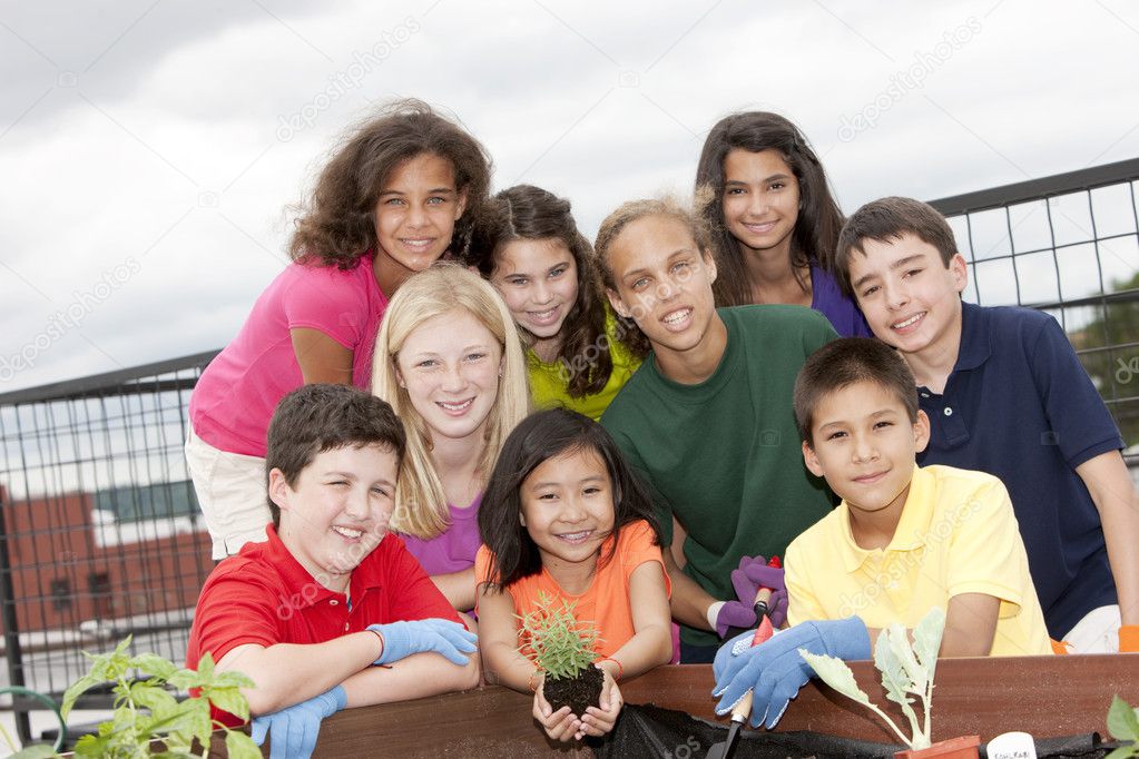 Smiling ethnically diverse children working together